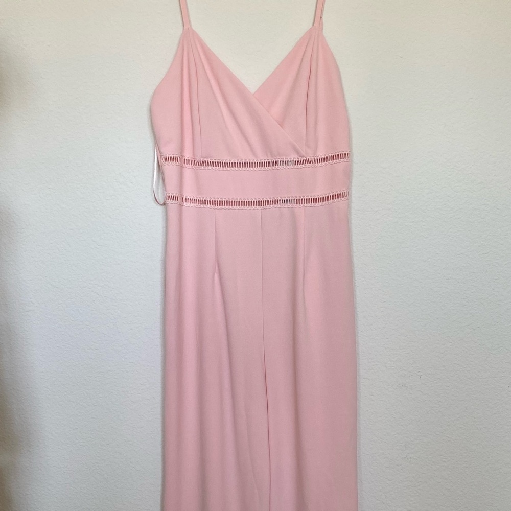 Baby pink jumpsuit with peak-a-boo stitching above waist. NWT